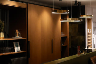 a kitchen with a bar and shelves